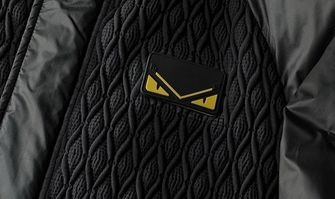 Hooded Puffer Jacket – Geometric Quilt & Monster Patch